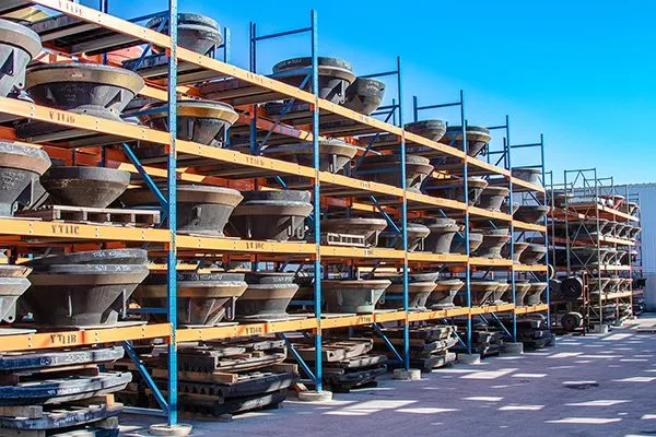 CWP cone crusher liner inventory racked in the yard